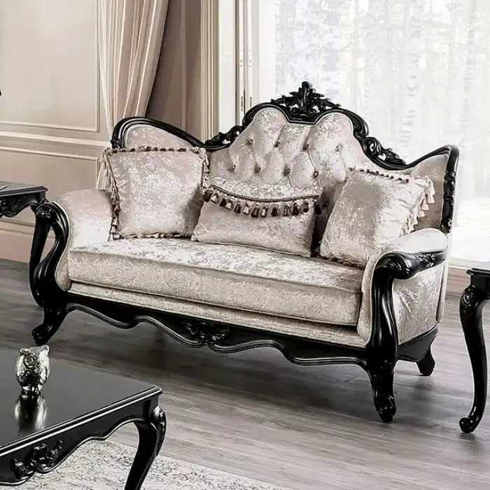 Traditional-style two-seater sofa featuring a button-tufted backrest and decorative throw pillows.