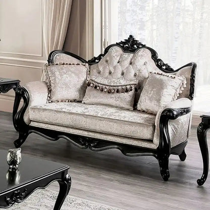 Traditional-style two-seater sofa featuring a button-tufted backrest and decorative throw pillows.