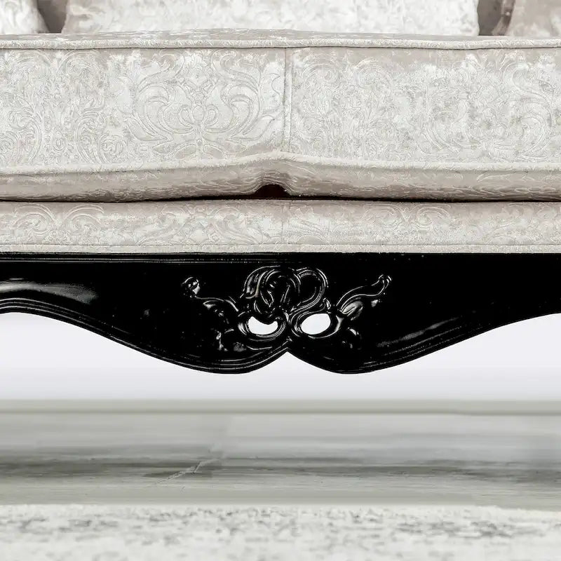 Traditional-style two-seater sofa featuring a button-tufted backrest and decorative throw pillows.