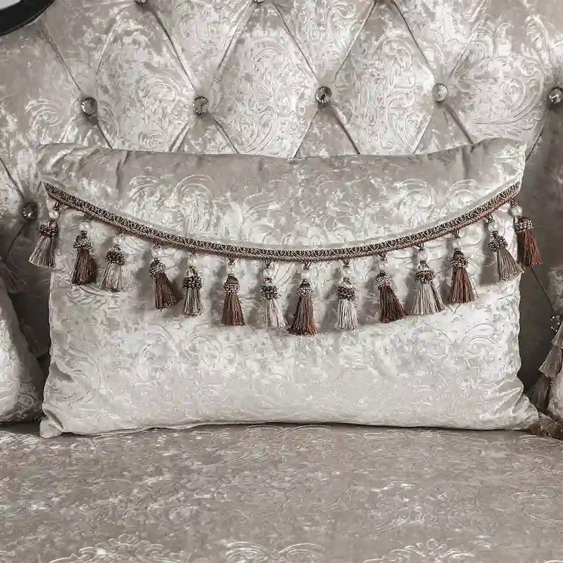 Traditional-style two-seater sofa featuring a button-tufted backrest and decorative throw pillows.