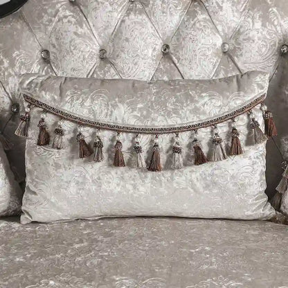 Traditional-style two-seater sofa featuring a button-tufted backrest and decorative throw pillows.