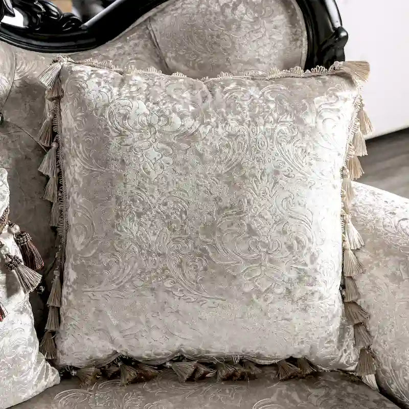 Traditional-style two-seater sofa featuring a button-tufted backrest and decorative throw pillows.