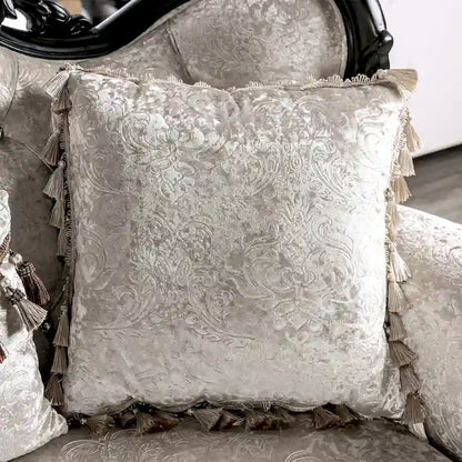 Traditional-style two-seater sofa featuring a button-tufted backrest and decorative throw pillows.