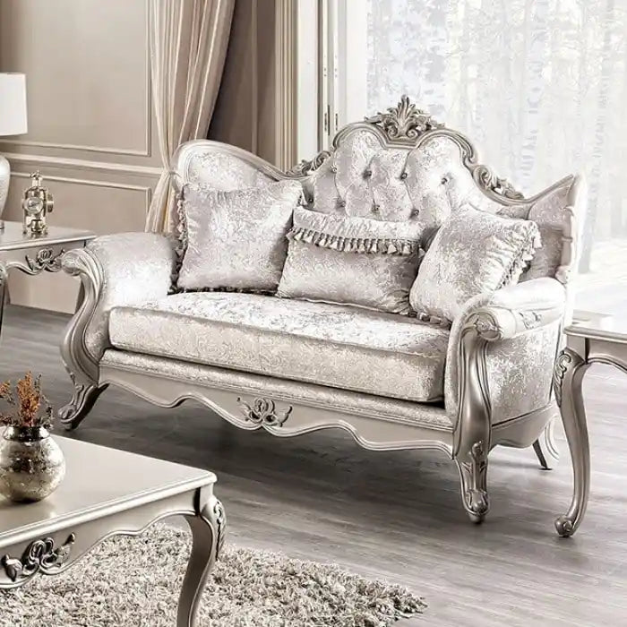 Traditional-style two-seater sofa featuring a button-tufted backrest and decorative throw pillows.