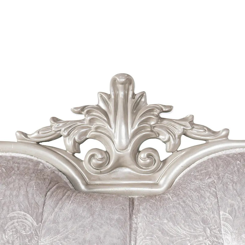Traditional-style two-seater sofa featuring a button-tufted backrest and decorative throw pillows.
