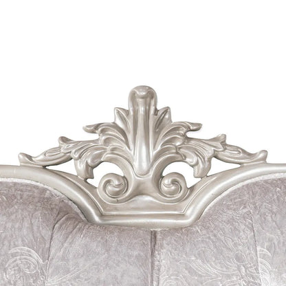 Traditional-style two-seater sofa featuring a button-tufted backrest and decorative throw pillows.