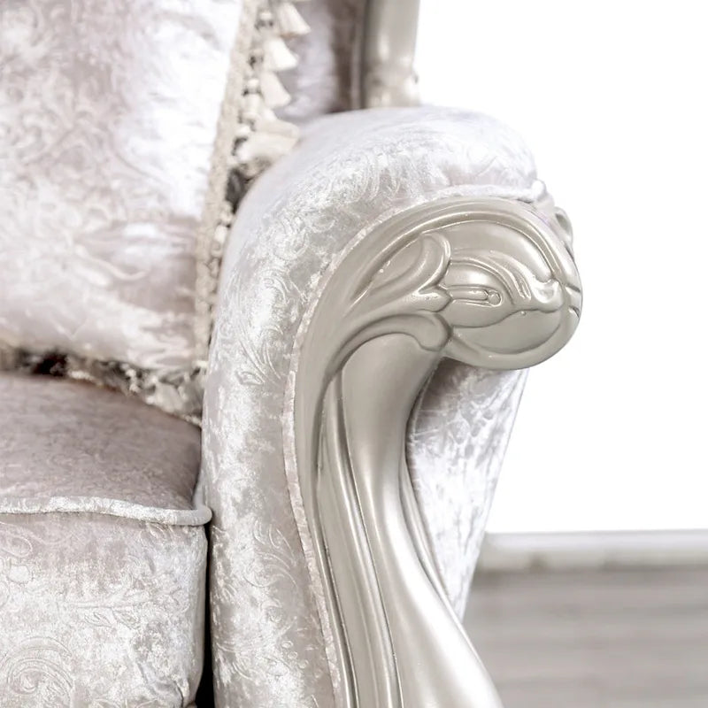 Traditional-style two-seater sofa featuring a button-tufted backrest and decorative throw pillows.