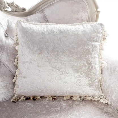 Traditional-style two-seater sofa featuring a button-tufted backrest and decorative throw pillows.