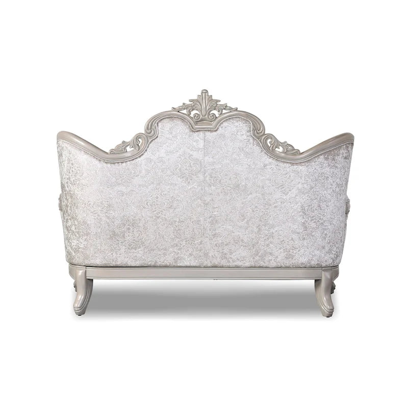 Traditional-style two-seater sofa featuring a button-tufted backrest and decorative throw pillows.