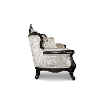 Traditional-style two-seater sofa featuring a button-tufted backrest and decorative throw pillows.