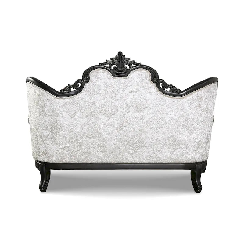 Traditional-style two-seater sofa featuring a button-tufted backrest and decorative throw pillows.
