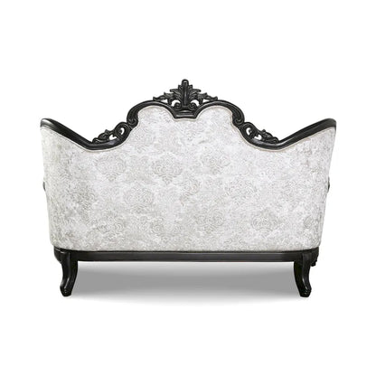 Traditional-style two-seater sofa featuring a button-tufted backrest and decorative throw pillows.